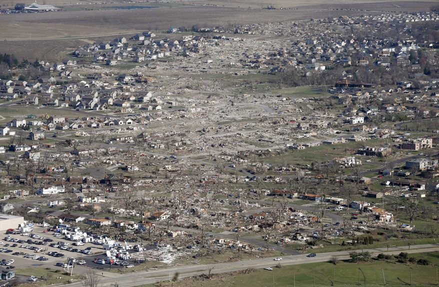 This aerial view on Monday, Nov. 18, 2013, shows the path of a tornado that hit the western Illinois town of Washington on Sunday. It was one of the worst-hit areas after intense storms and tornadoes swept through Illinois. The National Weather Service says the tornado that hit Washington had a preliminary rating of EF-4, meaning wind speeds of 170 mph to 190 mph. (AP Photo/Charles Rex Arbogast)