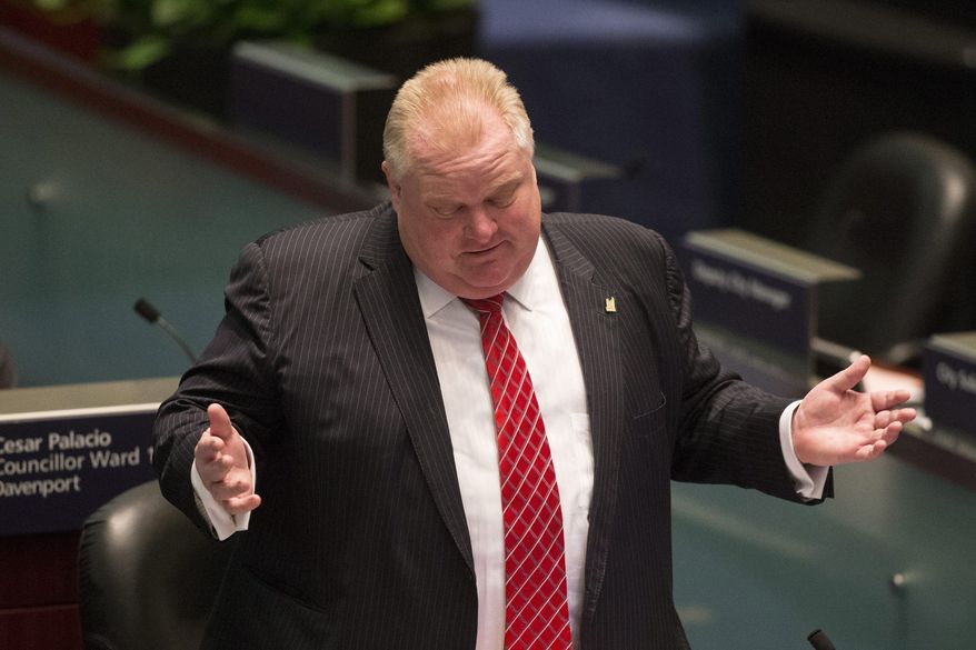 Toronto Mayor Rob Ford attends a City Council meeting as councilors look to pass motions to limit his powers on Monday, Nov. 18, 2013, in Toronto. (AP Photo/The Canadian Press, Chris Young)