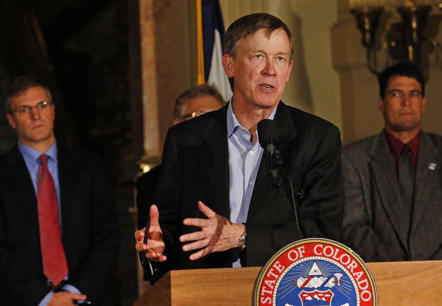 **FILE** Colo. Gov. John Hickenlooper speaks to members of the media during a news conference at the state Capitol in Denver on Nov. 18, 2013. (Associated Press)