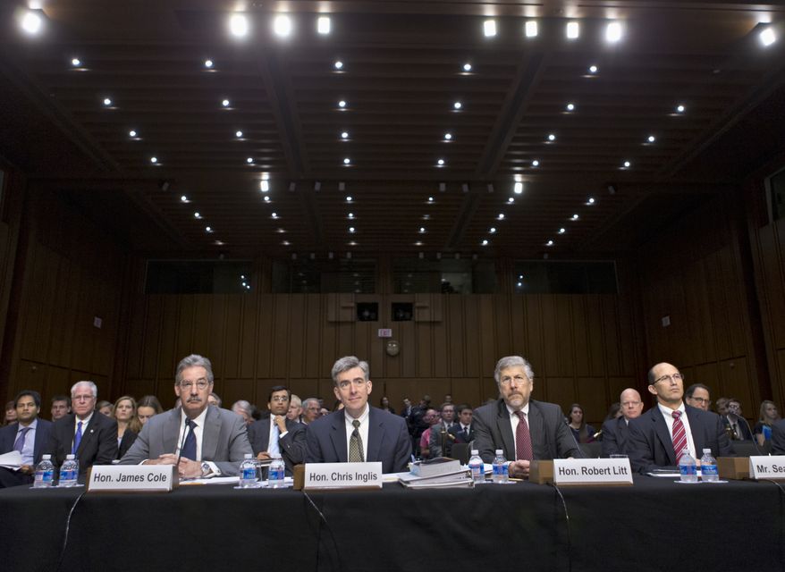 From left, Deputy Attorney General James Cole; National Security Agency Deputy Director John C. Inglis; Robert Litt, general counsel in the Office of Director of National Intelligence; and Sean Joyce, deputy director of the FBI, wait to testify on Capitol Hill in Washington, Wednesday, July 31, 2013, as the Senate Intelligence Committee, questions them about the NSA's surveillance programs for the first time since the House narrowly rejected a proposal last week to effectively shut down the NSA's secret collection of hundreds of millions of Americans' phone records. (AP Photo/J. Scott Applewhite)