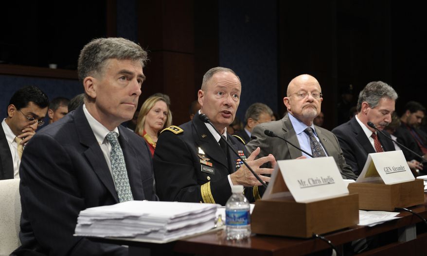 From left, Deputy National Security Agency Director Chris Inglis, National Security Agency Director Gen. Keith Alexander, Director of National Intelligence James Clapper and Deputy Attorney General James Cole, testifies on Capitol Hill in Washington, Tuesday, Oct. 29, 2013, before the House Intelligence Committee hearing on potential changes to the Foreign Intelligence Surveillance Act (FISA). Faced with anger over revelations about U.S. spying at home and abroad, members of Congress suggested Tuesday that programs the Obama administration says are needed to combat terrorism may have gone too far. (AP Photo/Susan Walsh)