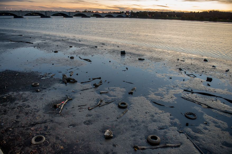 Tires and other debris floats in the Potomac River near Memorial Bridge, Washington, D.C., Tuesday, November 19, 2013. (Andrew Harnik/The Washington Times)