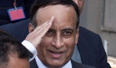 ** FILE ** In this Monday, Jan. 9, 2012, file photo, Pakistan&#39;s former ambassador to the U.S., Husain Haqqani salutes to media as he leaves after appearing before a judicial commission at a high court in Islamabad, Pakistan.  (AP Photo/Anjum Naveed, File)