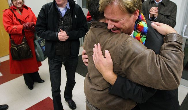 The Rev. Frank Schaefer, right, of Lebanon Pa., gets hug from supporter Andrew Monath, of New Hope Pa., after the sentencing phase of the trial at Camp Innabah, a United Methodist retreat, in Spring City Pa. Tuesday Nov. 19, 2013. A jury of his pastoral peers convicted Schaefer on Monday of breaking his vows by officiating his gay sons&#x27; Massachusetts wedding in 2007. Schaefer was given a 30 day suspension by the church.(AP Photo/Chris Knight)