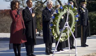 President Barack Obama, first lady Michelle Obama, former President Bill Clinton and his wife former Secretary of State Hillary Rodham Clinton, pause during a wreath laying ceremony in honor of President John F. Kennedy, Wednesday, Nov. 20, 2013, at Arlington National Cemetery in Arlington, Va. Friday will mark the 50th anniversary of the Kennedy assassination. (AP Photo/Pablo Martinez Monsivais)