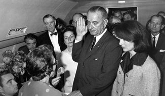 ADVANCE FOR USE SUNDAY, NOV. 17, 2013 AND THEREAFTER - FILE - In this Friday, Nov. 22, 1963 photo from the White House via the John Fitzgerald Kennedy Library in Boston, Lyndon B. Johnson is sworn in as president as Jacqueline Kennedy stands at his side in the cabin of the presidential plane on the ground at Love Field in Dallas. Judge Sarah T. Hughes, a Kennedy appointee to the Federal court, left, administers the oath. In background, from left are, Associate Press Secretary Malcolm Kilduff, holding microphone; Jack Valenti, administrative assistant to Johnson; Rep. Albert Thomas, D-Texas.; Lady Bird Johnson; and Rep. Jack Brooks, D-Texas. (AP Photo/White House, Cecil Stoughton, via the John Fitzgerald Kennedy Library, Boston)