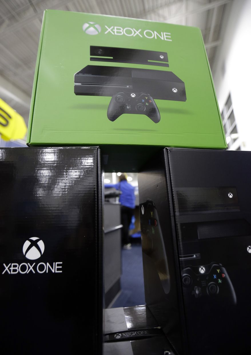The Xbox One is on display at a Best Buy store on Friday, Nov. 22, 2013., in Evanston, Ill. Microsoft is billing the Xbox One, which includes an updated Kinect motion sensor, as an all-in-one entertainment system rather than just a gaming console. (AP Photo/Nam Y. Huh)