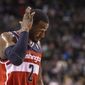 Washington Wizards&#39; John Wall reacts during the first half of an NBA basketball game against the Toronto Raptors in Toronto on Friday, Nov. 22, 2013. (AP Photo/The Canadian Press, Chris Young)