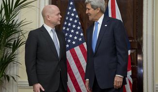 U.S. Secretary of State John Kerry, right, talks with British Foreign Secretary William Hague, at Winfield House, the residence of the U.S. Ambassador to Britain, in London, Sunday, Nov. 24, 2013. Kerry, arrived in the U.K. following two days of negotiations in Geneva to forge an agreement between the United States and five other nations with Iran over its nuclear programme. (AP Photo/Carolyn Kaster, Pool)