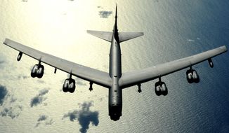 A B-52 bomber flies over the Pacific Ocean. (Image: U.S. Air Force) ** FILE **