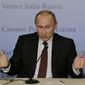 ** FILE ** Russian President Vladimir Putin gestures as he meets the media during a bilateral meeting between Italy and Russia, in Trieste, Italy, Tuesday, Nov. 26, 2013. (AP Photo/Luca Bruno)