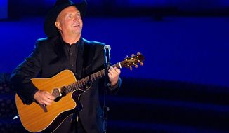 This June 16, 2011, file photo shows inductee Garth Brooks performing onstage at the 42nd Annual Songwriters Hall of Fame Awards in New York. (AP Photo/Charles Sykes, File) ** FILE ** 