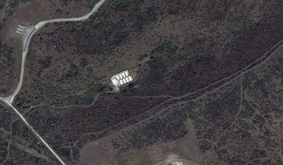 The secret CIA facility known as Penny Lane is shown in the upper middle in white in a 2010 satellite photo of the Naval Station Guantanamo Bay in Cuba. (AP Photo/TerraServer.com and DigitalGlobe)