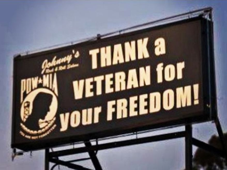 Two bar owners in Huntington Beach, Calif., said they are facing fines by the city for a billboard perched atop their establishment that displays a pro-military message.