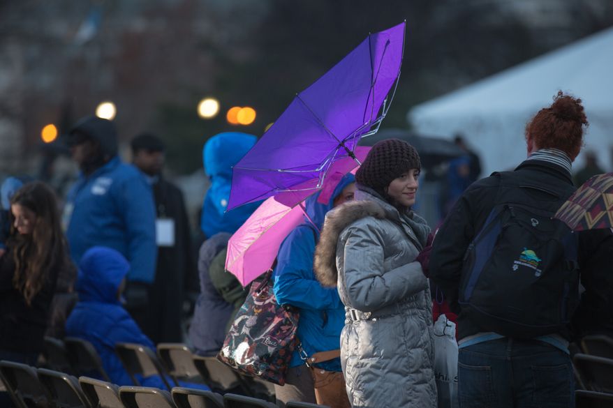 Visitors endure snow, rain and the cold during the lighting of the National Menorah, in Washington, DC., Wednesday, November 27, 2013. (Andrew S Geraci/The Washington Times)