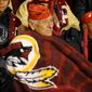 World War II Navajo code talkers stay warm along the sideline before being honored by the Redskins as the Washington Redskins play the San Francisco 49ers in Monday Night Football at FedExField, Landover, Md., Monday, November 25, 2013. (Andrew Harnik/The Washington Times)
