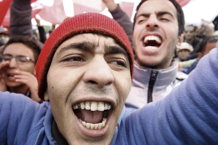 Tunisians march against the country's ruling Islamist Ennahda party in Siliana, northwest of Tunis during a general strike called to protest against the Tunisian government, Wednesday Nov 27, 2013 . General strikes were called in the northwestern city of Siliana, Gafsa and in Gabes, which is along the southeastern coast, calling for greater government investment. (AP Photo/Aimen Zine)