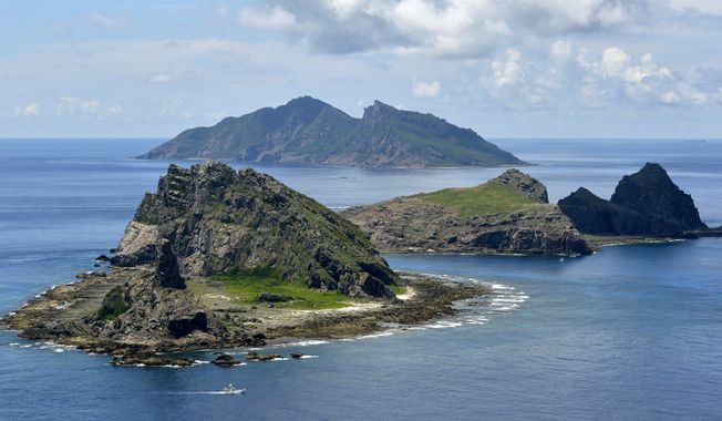 Minamikojima (foreground), Kitakojima, (middle right) and Uotsuri (background) are tiny islands in the East China Sea, called Senkaku in Japanese and Diaoyu in Chinese. (AP Photo/Kyodo News, File) 