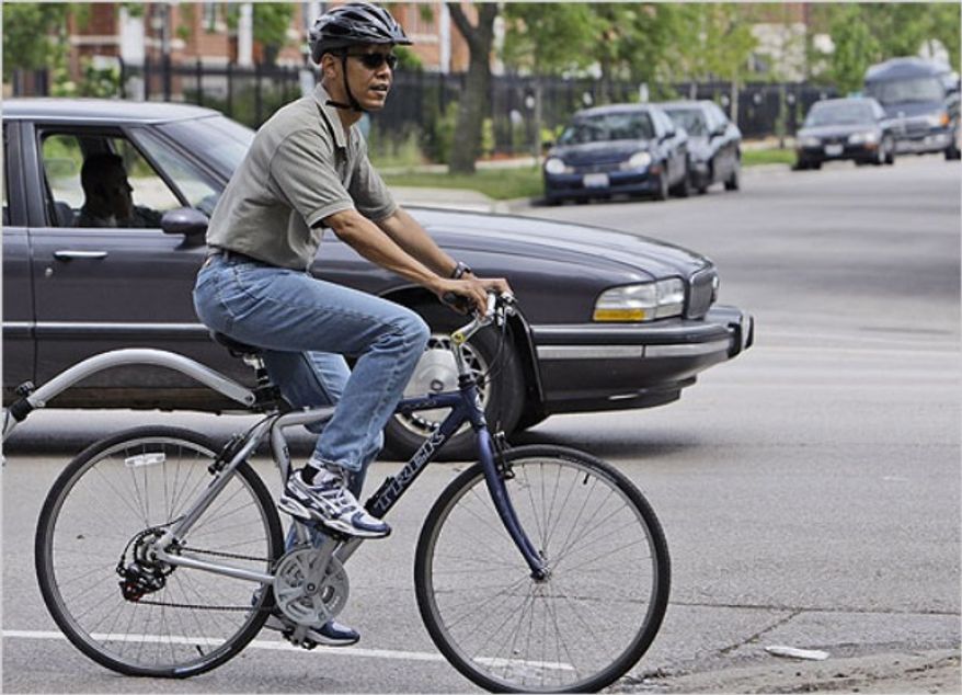 President Obama rides a bicycle in June, 2008. (credit: Associated Press)