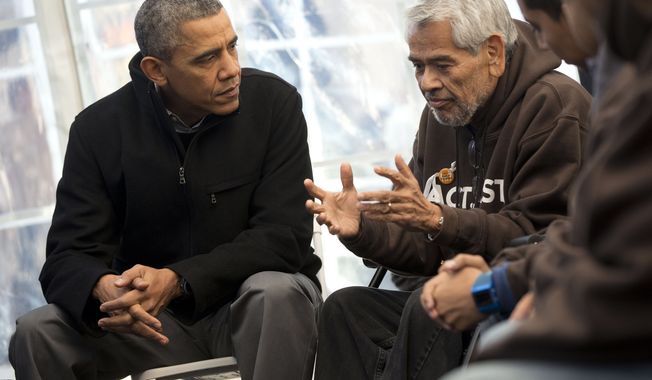 President Barack Obama, left, listens to Eliseo Medina, right, Secretary-Treasurer of Service Employees International Union (SEIU), as he meets with individuals who are taking part in Fast for Families on the National Mall in Washington, Friday, Nov. 29, 2013. Obama met with the group who are fasting on behalf of immigration reform. (AP Photo/Pablo Martinez Monsivais)