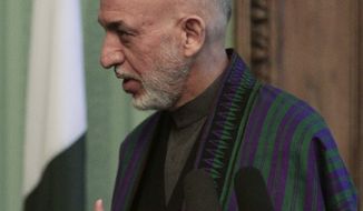 Afghan President Hamid Karzai speaks during a joint press conference with Pakistani Prime Minister Nawaz Sharif in Kabul, Afghanistan, Saturday, Nov. 30, 2013. Sharif said Saturday that the recent release of a senior Taliban leader shows he is committed to helping bring peace to Afghanistan. (AP Photo/Rahmat Gul)