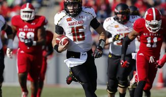 Maryland quarterback C.J. Brown (16) runs for a 49-yard touchdown during the first half of an NCAA college football game against North Carolina State on Saturday, Nov. 30, 2013, in Raleigh, N.C., (AP Photo/The News &amp; Observer, Ethan Hyman) 