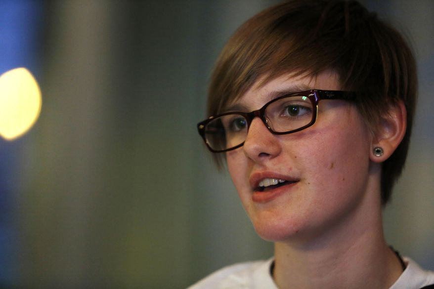 Skylar Crownover discusses preferred gender pronouns with other members of Mouthing Off!, a group for students at Mills College in Oakland, Calif., who identify as gay, lesbian, bisexual or transgender, Monday, Nov. 25, 2013. PGPs such as "they" or "ze" are used by some genderqueer people who identify as gender neutral or even both male and female. (AP Photo/Mathew Sumner)