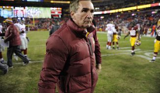Washington Redskins head coach Mike Shanahan walks off the field after an NFL football game against the New York Giants Sunday, Dec. 1, 2013, in Landover, Md. The Giants won 24-17. (AP Photo/Nick Wass)