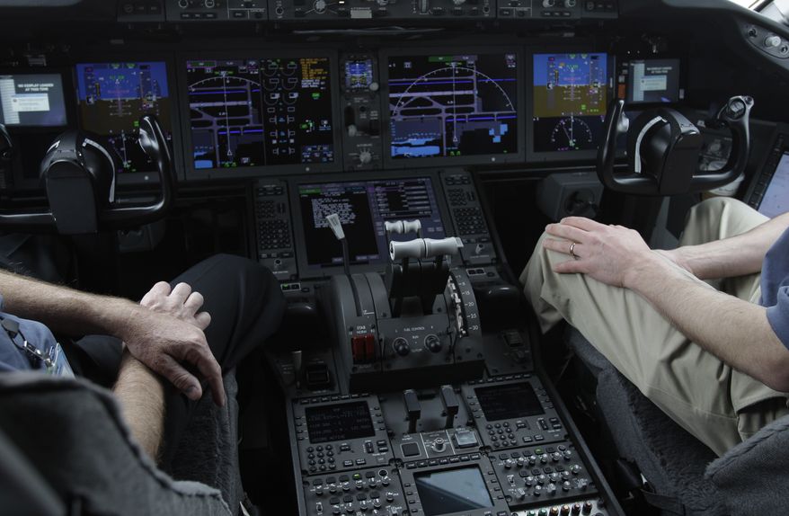 In this Feb. 3, 2011, photo, the cockpit of Boeings' new 787 Dreamliner is photographed in Houston. Pilots are becoming so reliant on the computer systems that do most of the flying in today’s airliners that on the rare occasions when something goes wrong, they’re sometimes unprepared to take control, according to aviation safety experts and government and industry studies. Increasing automation has been a tremendous safety boon to aviation, contributing to historically low accident rates in the U.S. and many parts of the world. (AP Photo/Pat Sullivan)