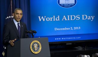**FILE** President Obama gestures while speaking at a world AIDS Day event on Dec. 2, 2013, in the South Court Auditorium on the White House complex in Washington. (Associated Press)