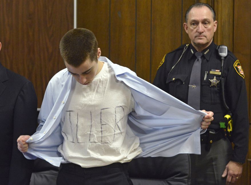 FOR USE AS DESIRED, YEAR END PHOTOS - FILE - T.J. Lane unbuttons his shirt during sentencing Tuesday, March 19, 2013, in Chardon, Ohio. Lane, was given three lifetime prison sentences without the possibility of parole for opening fire last year in a high school cafeteria in a rampage that left three students dead and three others wounded. (AP Photo/The News-Herald, Duncan Scott, Pool, File)
