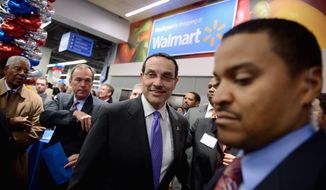 Talking shop: D.C. Mayor Vincent C. Gray, who touts his economic record, visits one of the first Wal-Marts in the city on the eve of its opening. Story, A11. (Andrew Harnik/The Washington Times)