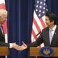 Then-U.S. Vice President Joe Biden shakes hands with Japanese Prime Minister Shinzo Abe at the end of a joint press conference following their meeting at Abe&#39;s official residence in Tokyo Tuesday, Dec. 3, 2013. (AP Photo/Koji Sasahara) ** FILE **