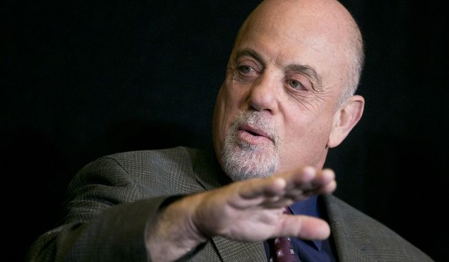 Singer-songwriter Billy Joel speaks at a news conference at Madison Square Garden in New York on Tuesday, Dec. 3, 2013, at which he announced he will perform a residency at the famed arena once a month for as many months as New Yorkers demand. (AP Photo/Mark Lennihan)