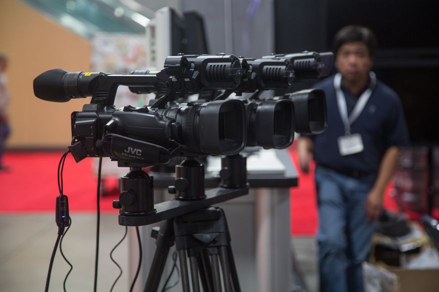 Video cameras worth thousands of dollars are set up for demonstration purposes as crews prepare for the 2013 Government Video Expo, held at the Walter E. Washington Convention Center, in Washington, DC., Tuesday, December 3, 2013. (Andrew S Geraci/The Washington Times)