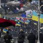 Flags wave over Independence Square during a rally in Kiev, Ukraine, on Wednesday Dec. 4, 2013. A resolution to Ukraine&#39;s political turmoil remained elusive as thousands of people continued rallying on Kiev&#39;s Independence Square and besieging key government buildings. (AP Photo/Ivan Sekretarev)