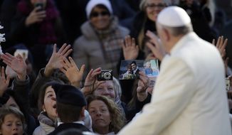 Pope Francis waves to faithful as he arrives in St. Peter&#39;s Square for the weekly general audience at the Vatican, Wednesday, Dec. 4, 2013. (AP Photo/Gregorio Borgia)