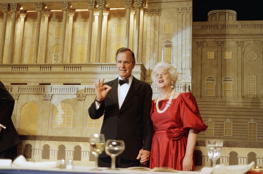 Vice President George Bush and his wife Barbara Bush are shown during a fundraiser in Washington where he picked up the endorsement of President Reagan in his bid to become the next president of the United States, May 12, 1988.  (AP Photo/Charles Tasnadi)