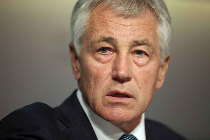 U.S. Secretary of Defense Chuck Hagel addresses the International Institute of Strategic Studies (IISS) conference in Manama, Bahrain, on Saturday, Dec. 7, 2013. The conference is expected to discuss regional security issues including the recently reached deal on Iran's nuclear program. (AP Photo/Hasan Jamali)