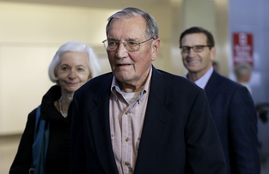 ** FILE ** Merrill Newman, center, walks beside his wife Lee, left, and his son Jeffrey after arriving at San Francisco International Airport on Saturday, Dec. 7, 2013. Newman was detained in North Korea late October at the end of a 10-day trip to North Korea, a visit that came six decades after he oversaw a group of South Korean wartime guerrillas during the 1950-53 war. (AP Photo/Ben Margot)