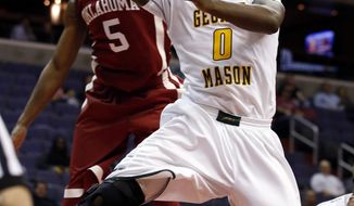 George Mason guard Bryon Allen (0) shoots in front of Oklahoma guard Je&#x27;lon Hornbeak (5) during the first half of an NCAA college basketball game in the BB&amp;T Classic, Sunday, Dec. 8, 2013, in Washington. Oklahoma won 81-66. (AP Photo/Alex Brandon)