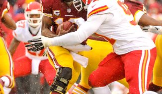 Kansas City Chiefs outside linebacker Tamba Hali (91) sacks Washington Redskins quarterback Robert Griffin III (10) in the second quarter as the Washington Redskins play the Kansas City Chiefs at FedExField, Landover, Md., Sunday, December 8, 2013. (Andrew Harnik/The Washington Times)