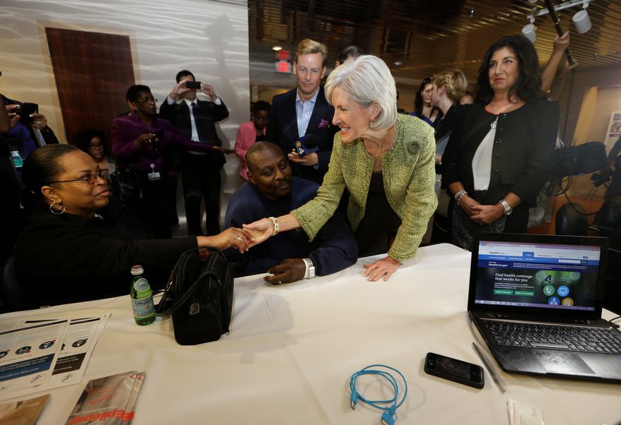 ** FILE ** Health and Human Services Secretary Kathleen Sebelius greets Mary and Willie Williams as they meet with a navigator about their health care options under the Affordable Care Act, at the North Shore Medical Center in Miami, on Tuesday, Nov 19, 2013. (Associated Press)