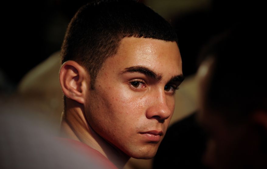 Elian Gonzalez attends an official event with Cuban President Raul Castro (not seen) in Havana on Wednesday, June 30, 2010. (AP Photo/Adalberto Roque, Pool)