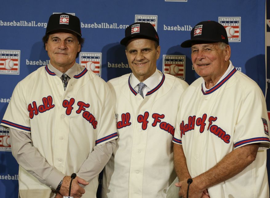 Retired managers, from left, Tony La Russa, Joe Torre and Bobby Cox gather for a photo after it was announced that they were unanimously elected to the baseball Hall of Fame during MLB winter meetings in Lake Buena Vista, Fla., Monday, Dec. 9, 2013.(AP Photo/John Raoux)