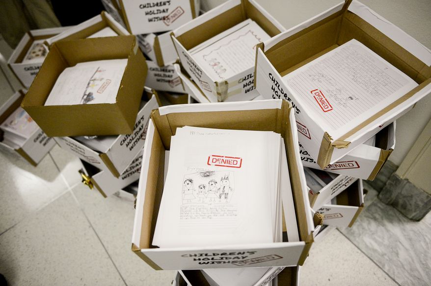 Thousands of holiday letters from children sit in boxes ready to be handed out to congressmen, calling on them to pass immigration reform during a demonstration organized by members of We Belong Together, a group for "common sense immigration reform" on Capitol Hill, Washington, D.C., Monday, December 9, 2013. (Andrew Harnik/The Washington Times)