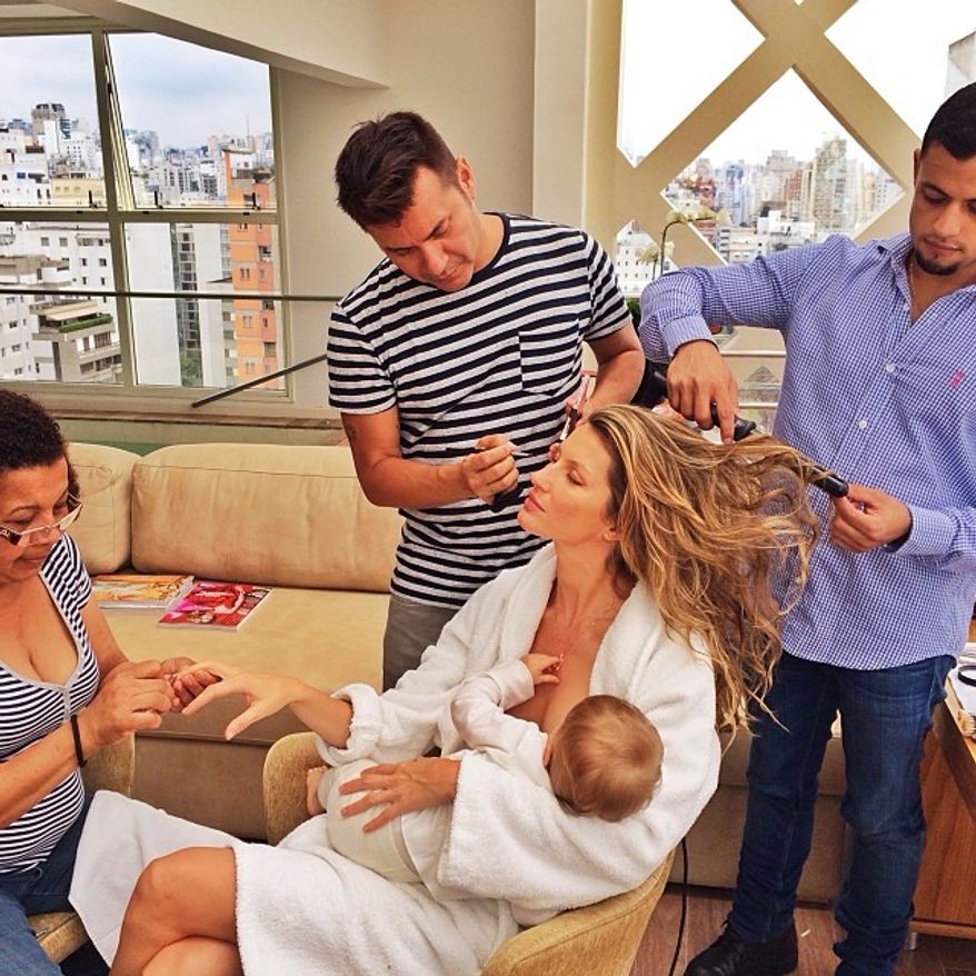 Supermodel Gisele Bundchen posted a photo on Instagram of her breastfeeding her one-year-old daughter while being primped by her beauty team.