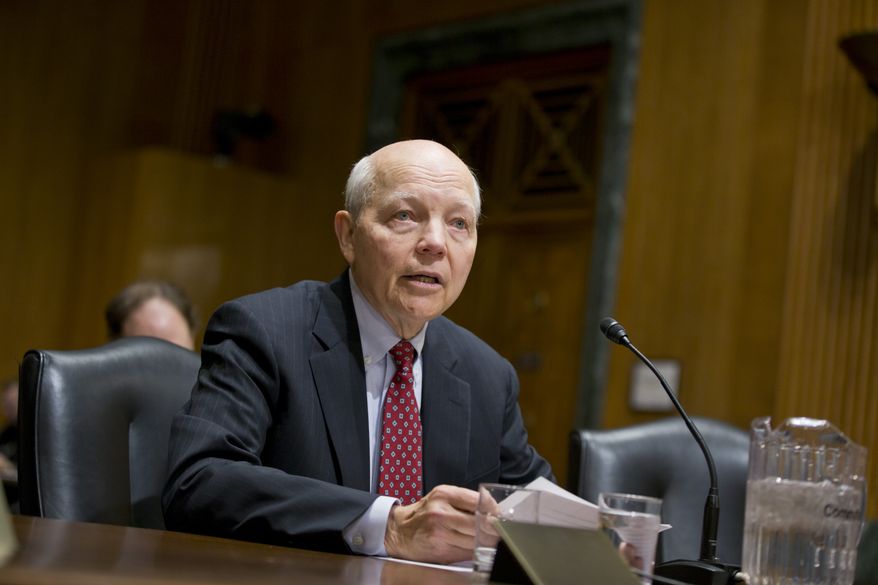 John Koskinen, President Barack Obama's choice to head the Internal Revenue Service (IRS) testifies on Capitol Hill in Washington, Tuesday, Dec. 10, 2013, before the Senate Finance Committee hearing on his nomination. Koskinen, 74, is a retired corporate and government official with experience managing numerous organizations in crisis. (AP Photo/J. Scott Applewhite)