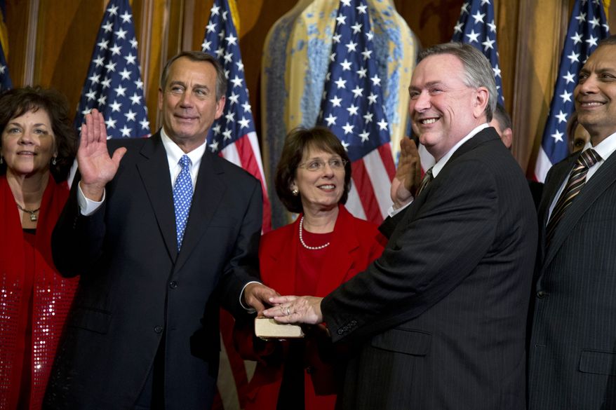 ** FILE ** In this Jan. 3, 2013, file photo, Rep. Steve Stockman, R-Texas, second from right, participates in a mock swearing-in ceremony with Speaker of the House Rep. John Boehner, R-Ohio, for the 113th Congress in Washington. Stockman shocked the political world by filing a last-minute Republican primary challenge Monday, Dec. 9, 2013, against incumbent U.S. Sen. John Cornyn. Cornyn is the Senate's minority whip and had appeared likely to escape a major primary challenge from the tea party or other conservative factions. (AP Photo/ Evan Vucci, File)
