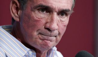 Washington Redskins head coach Mike Shanahan pauses while speaking during a media availability at their NFL football training facility, Wednesday, Dec. 11, 2013, in Ashburn, Va. Kirk Cousins will start for the Washington Redskins on Sunday, and Robert Griffin III will be the No. 3 quarterback behind Rex Grossman. (AP Photo/Alex Brandon)